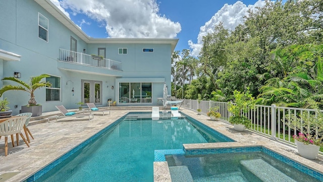 1076 Toc0Baga, Sarasota, FL 34234 - view of pool featuring french doors, a fenced backyard, a patio, and a pool with connected hot tub