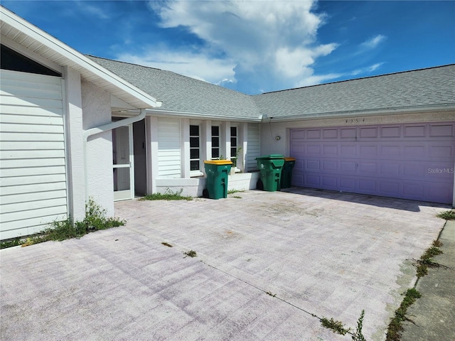 4354 Rock Creek Dr, Port Charlotte, FL 33948 - exterior space with driveway, a garage, and a shingled roof