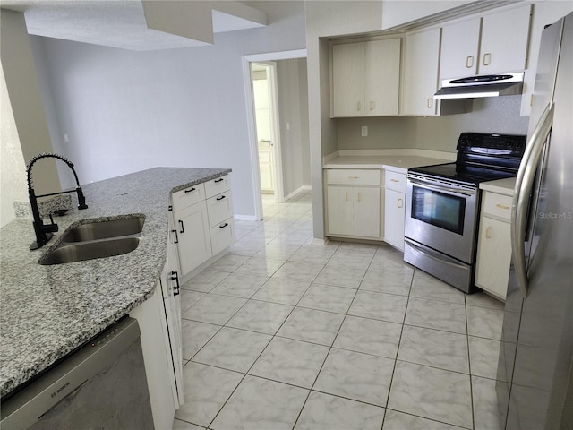 4354 Rock Creek Dr, Port Charlotte, FL 33948 - kitchen featuring appliances with stainless steel finishes, under cabinet range hood, light stone counters, and light tile patterned flooring