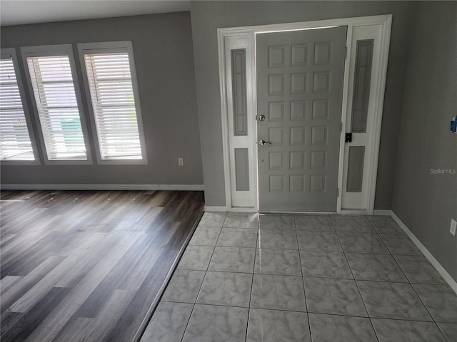 4354 Rock Creek Dr, Port Charlotte, FL 33948 - entryway with baseboards and light wood-type flooring