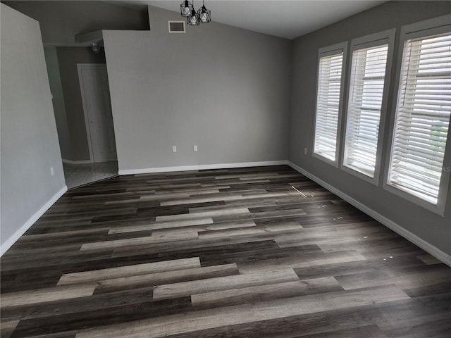 4354 Rock Creek Dr, Port Charlotte, FL 33948 - unfurnished dining area featuring lofted ceiling, dark wood-style flooring, and a chandelier