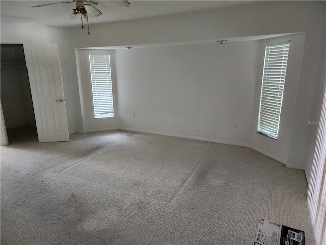 4354 Rock Creek Dr, Port Charlotte, FL 33948 - unfurnished bedroom with light colored carpet and a ceiling fan