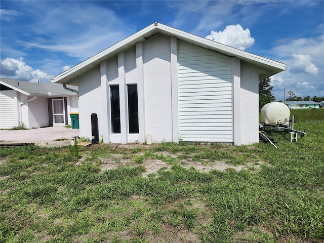 4354 Rock Creek Dr, Port Charlotte, FL 33948 - back of property featuring stucco siding