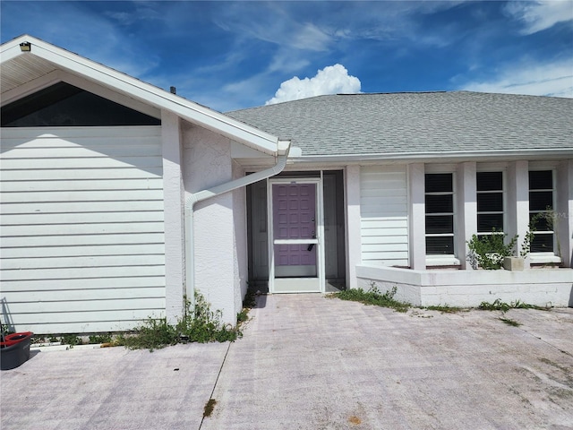 4354 Rock Creek Dr, Port Charlotte, FL 33948 - property entrance featuring roof with shingles