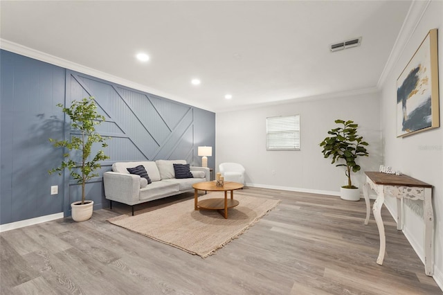 1008 37th St W, Bradenton, FL 34205 - living area featuring crown molding, stairs, wood finished floors, recessed lighting, and a decorative wall