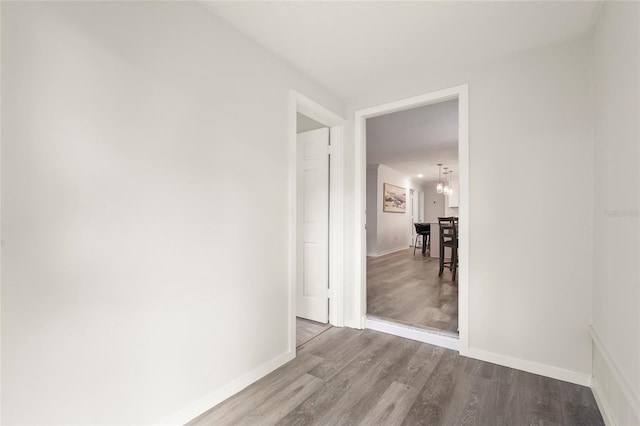 1008 37th St W, Bradenton, FL 34205 - unfurnished room with wood finished floors and a chandelier