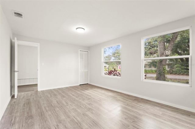 1008 37th St W, Bradenton, FL 34205 - spare room featuring wood finished floors and baseboards