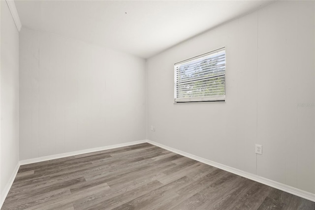 1008 37th St W, Bradenton, FL 34205 - empty room featuring wood finished floors and baseboards