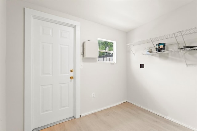 1008 37th St W, Bradenton, FL 34205 - washroom featuring hookup for an electric dryer and light wood-type flooring
