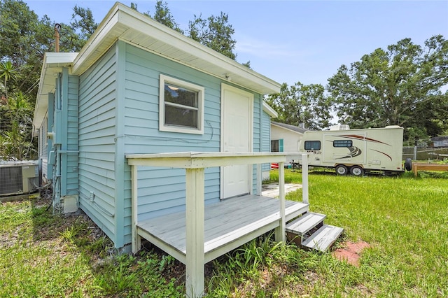 1008 37th St W, Bradenton, FL 34205 - rear view of house with a yard and a wooden deck