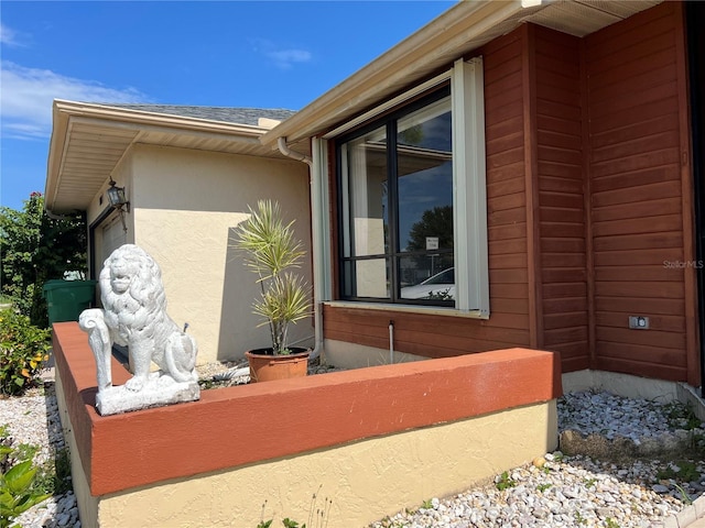19358 Edgewater Dr, Port Charlotte, FL 33948 - view of home's exterior with stucco siding and a shingled roof