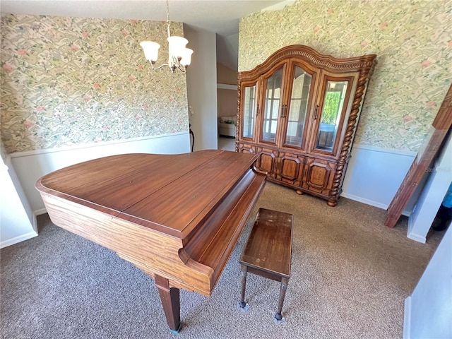 19358 Edgewater Dr, Port Charlotte, FL 33948 - carpeted dining room featuring wallpapered walls, a chandelier, and wainscoting