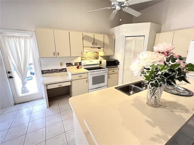19358 Edgewater Dr, Port Charlotte, FL 33948 - kitchen featuring white range with electric stovetop, stainless steel microwave, under cabinet range hood, ceiling fan, and light countertops