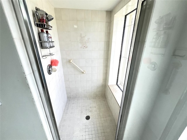 19358 Edgewater Dr, Port Charlotte, FL 33948 - full bathroom featuring a stall shower, tile patterned floors, and tile walls