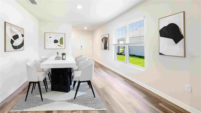 12039 Lansing Gln, Parrish, FL 34219 - dining space featuring wood finished floors and recessed lighting