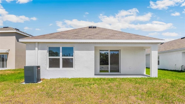 12039 Lansing Gln, Parrish, FL 34219 - rear view of property featuring a yard, stucco siding, and a shingled roof