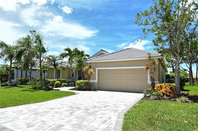 5080 Timber Chase Way, Sarasota, FL 34238 - ranch-style home with an attached garage, a front lawn, decorative driveway, stucco siding, and a tile roof