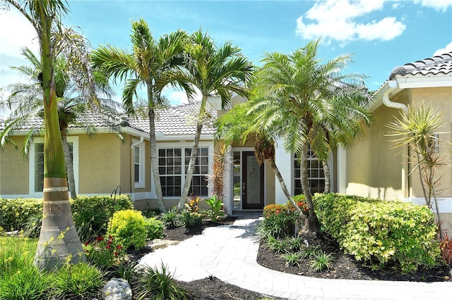 5080 Timber Chase Way, Sarasota, FL 34238 - property entrance featuring stucco siding and a tile roof