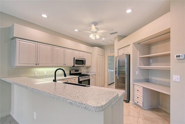 5080 Timber Chase Way, Sarasota, FL 34238 - kitchen with appliances with stainless steel finishes, light countertops, a peninsula, a ceiling fan, and recessed lighting