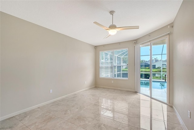5080 Timber Chase Way, Sarasota, FL 34238 - spare room featuring healthy amount of natural light, ceiling fan, and light tile patterned floors