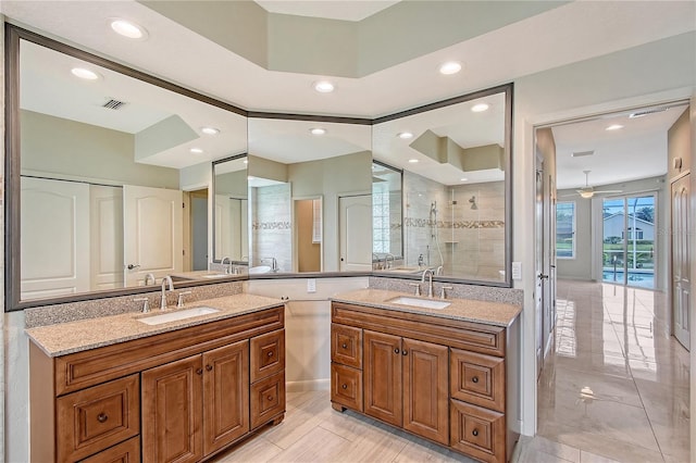5080 Timber Chase Way, Sarasota, FL 34238 - bathroom featuring vanity, tiled shower, recessed lighting, and ceiling fan