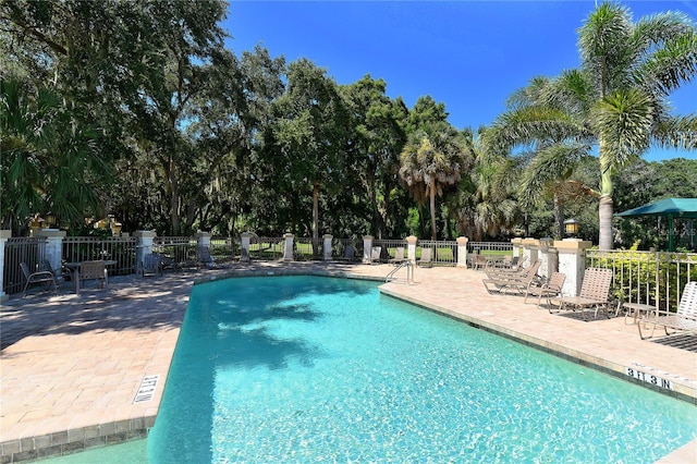 5080 Timber Chase Way, Sarasota, FL 34238 - community pool featuring a patio area and view of wooded area