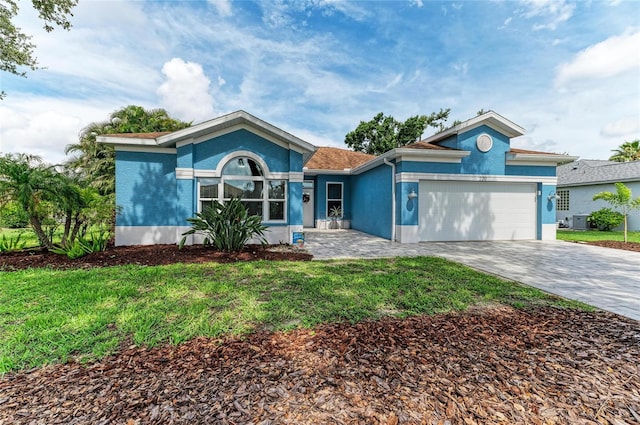 220 39th St NE, Bradenton, FL 34208 - ranch-style house with stucco siding, a garage, a front yard, and driveway