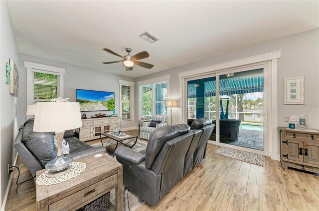220 39th St NE, Bradenton, FL 34208 - living area featuring ceiling fan and light wood-style flooring