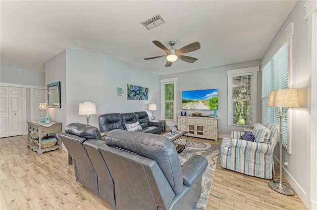 220 39th St NE, Bradenton, FL 34208 - living room with light wood-type flooring, ceiling fan, and healthy amount of natural light