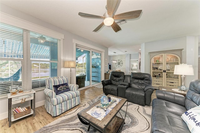 220 39th St NE, Bradenton, FL 34208 - living room featuring a ceiling fan and light wood-style floors