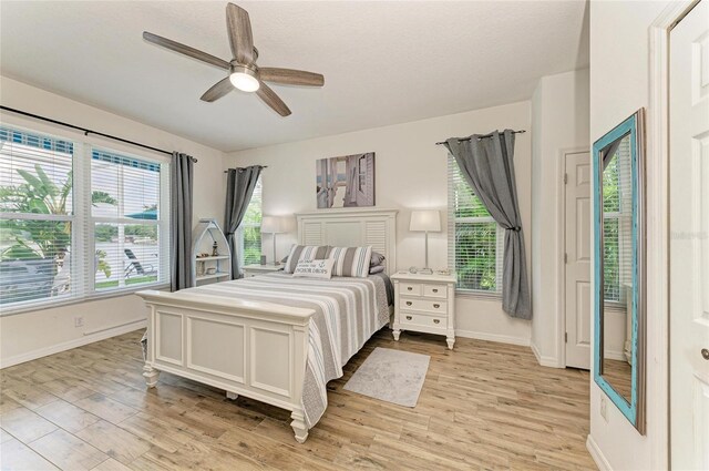 220 39th St NE, Bradenton, FL 34208 - bedroom featuring light wood finished floors and a ceiling fan