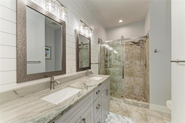 220 39th St NE, Bradenton, FL 34208 - full bath with a stall shower, double vanity, and recessed lighting