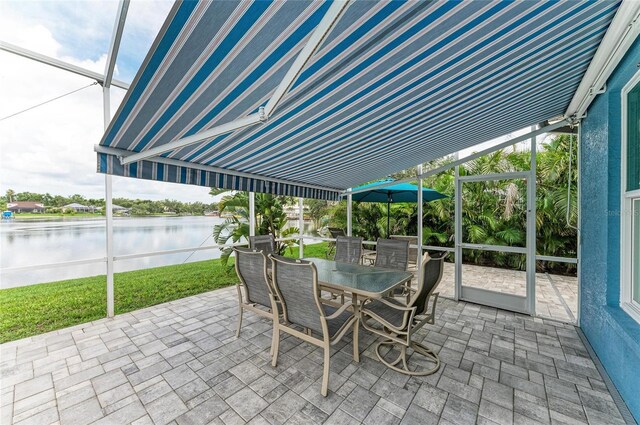 220 39th St NE, Bradenton, FL 34208 - sunroom with outdoor dining space and a water view