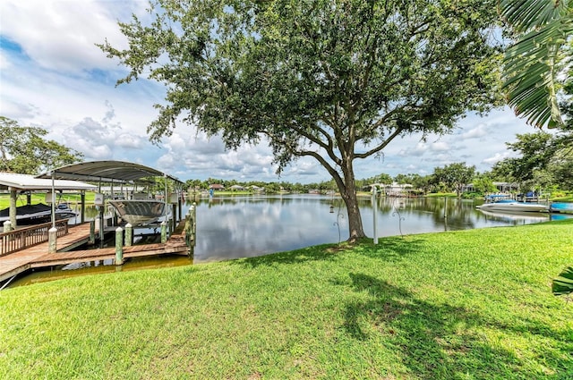 220 39th St NE, Bradenton, FL 34208 - dock with boat lift, a yard, and a water view