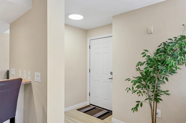 1240 Siesta Bayside Dr Unit 1240C, Sarasota, FL 34242 - foyer entrance featuring wood finished floors and baseboards