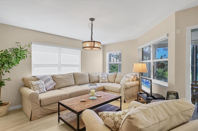 1240 Siesta Bayside Dr Unit 1240C, Sarasota, FL 34242 - living area featuring light wood-type flooring and baseboards