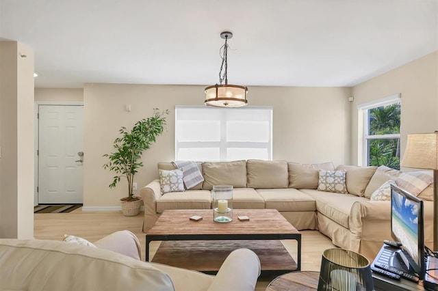 1240 Siesta Bayside Dr Unit 1240C, Sarasota, FL 34242 - living room with light wood-style floors and baseboards