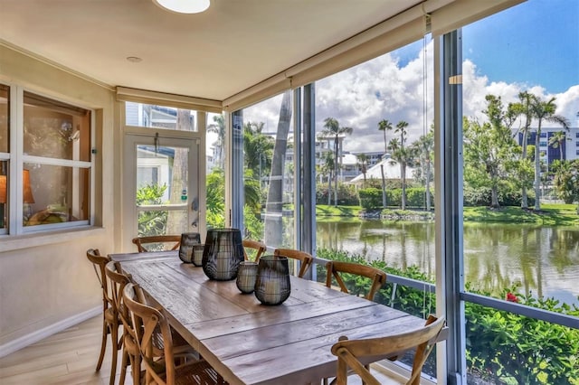 1240 Siesta Bayside Dr Unit 1240C, Sarasota, FL 34242 - sunroom / solarium featuring a water view