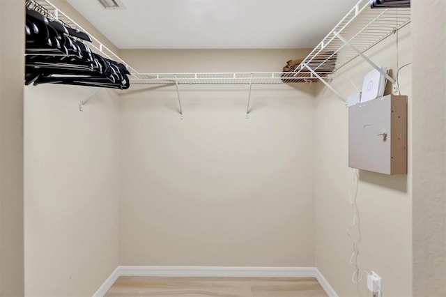 1240 Siesta Bayside Dr Unit 1240C, Sarasota, FL 34242 - walk in closet featuring wood finished floors