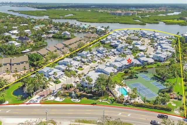 1240 Siesta Bayside Dr Unit 1240C, Sarasota, FL 34242 - aerial perspective of suburban area with a nearby body of water and property parcel outlined