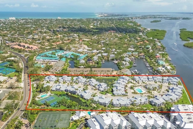 1240 Siesta Bayside Dr Unit 1240C, Sarasota, FL 34242 - aerial perspective of suburban area with a nearby body of water and property boundaries highlighted