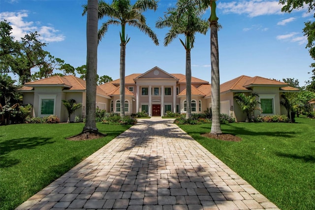 550 Dove Pointe, Osprey, FL 34229 - view of front facade with stucco siding, a front yard, and decorative driveway