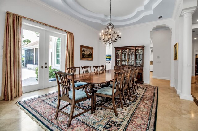 550 Dove Pointe, Osprey, FL 34229 - dining room featuring a raised ceiling, french doors, arched walkways, crown molding, and a chandelier