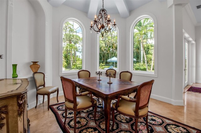 550 Dove Pointe, Osprey, FL 34229 - dining room featuring healthy amount of natural light, a chandelier, and beamed ceiling