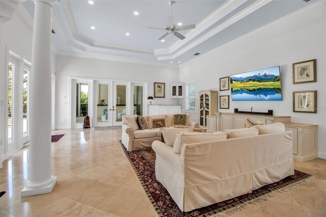 550 Dove Pointe, Osprey, FL 34229 - living room with decorative columns, plenty of natural light, a towering ceiling, french doors, and ornamental molding