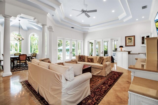 550 Dove Pointe, Osprey, FL 34229 - living area featuring decorative columns, a high ceiling, french doors, ceiling fan, and a tray ceiling