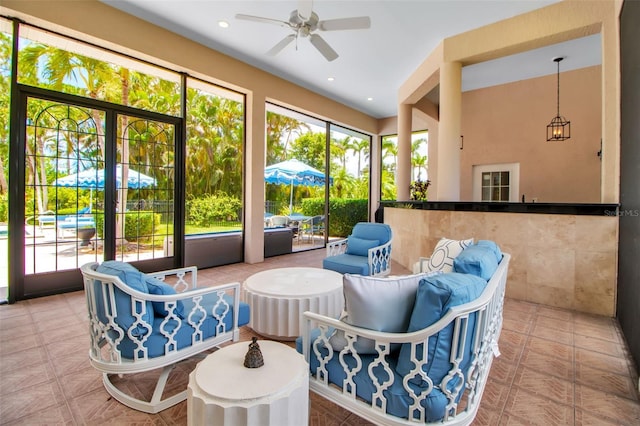 550 Dove Pointe, Osprey, FL 34229 - sunroom with ceiling fan and an outdoor hangout area