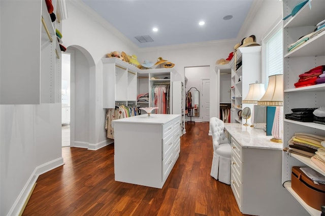 550 Dove Pointe, Osprey, FL 34229 - walk in closet featuring dark wood-type flooring and arched walkways