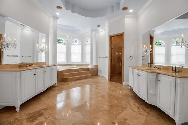 550 Dove Pointe, Osprey, FL 34229 - bathroom with a chandelier, plenty of natural light, a raised ceiling, ornamental molding, and recessed lighting