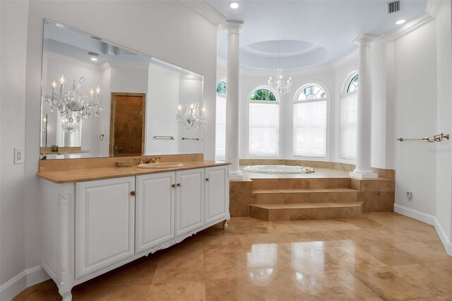 550 Dove Pointe, Osprey, FL 34229 - bathroom featuring a chandelier, a bath, decorative columns, vanity, and ornamental molding